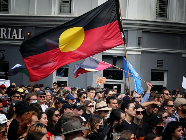 Protesters gather outside the Victorian Parliament for the Invasion Day rally. Picture: Luis Enrique Ascui