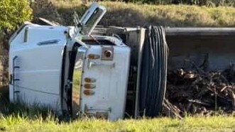 A truck rolled over on Pialba-Burrum Heads Rd near Mitchell Avenue at Craignish on Friday afternoon. Photo: Facebook.