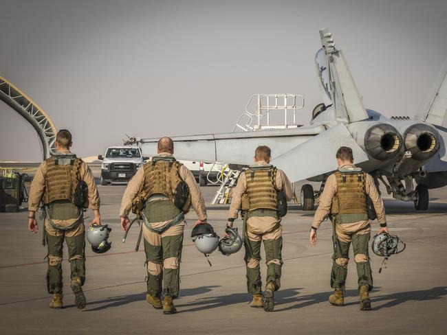 F/A-18F Super Hornet aircrew walk out for the final mission on Operation OKRA at the main air operating base in the Middle East Region. Australian Hornet aircrew have been sufferying hypoxia. Picture: Defence