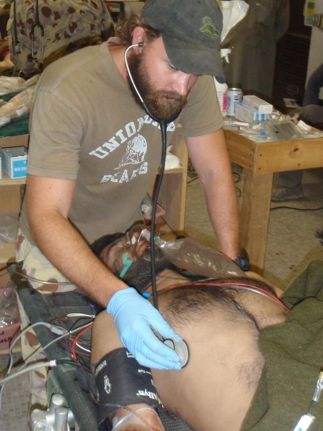 Voodoo Medic Dan Pronk treats a patient in the field.