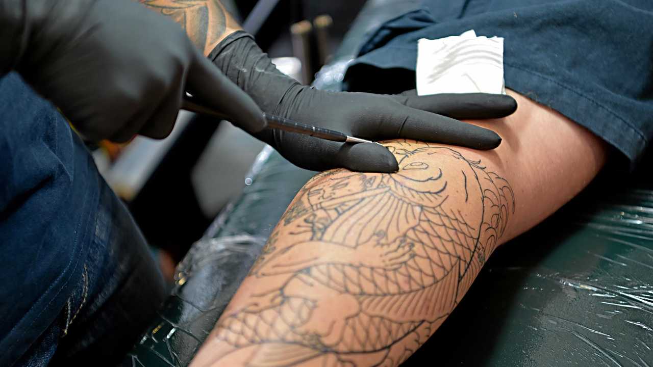 Coast artist's niche, traditional 'hand carving' tattoo style | The Courier  Mail