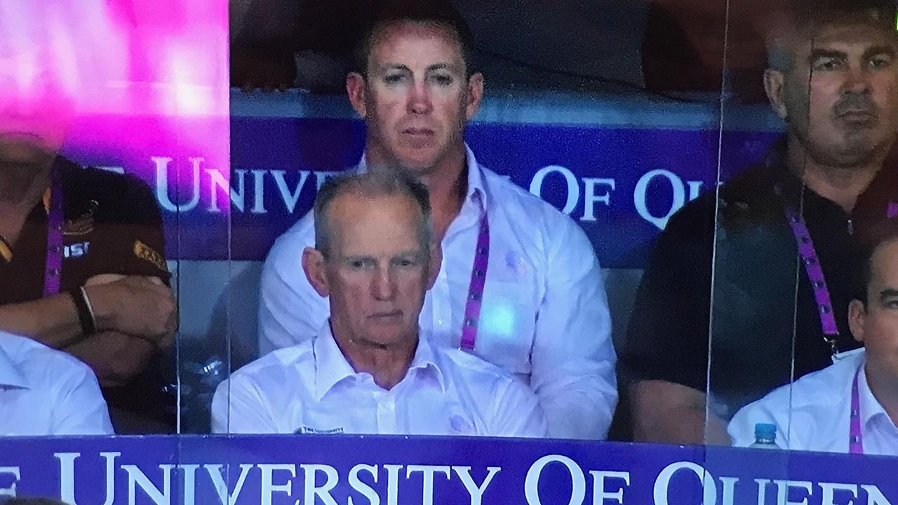 Former Brisbane official and player Andrew Gee (right) in the Broncos' coaches box during the elimination final loss the St George Illawarra.