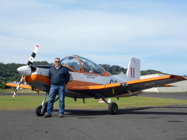 FLYING PAROTS: Gary Herne with his brightly painted CT-4 basic trainer, in which a generation of Australian Defence Force (ADF) pilots made a first, anxious solo flight.