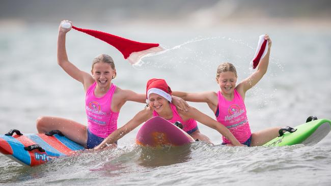 Mordialloc Life Saving Club nippers Meg, Paige and Gemma get into the Christmas spirit.