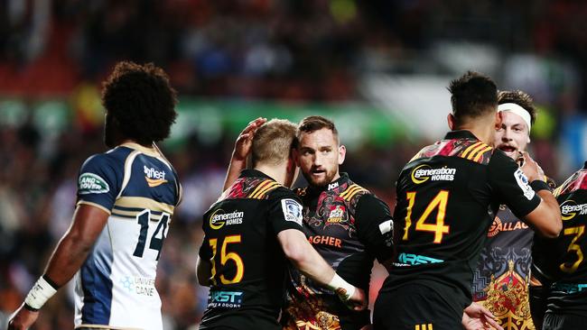 Aaron Cruden of the Chiefs congratulates teammate Damian McKenzie after his try.