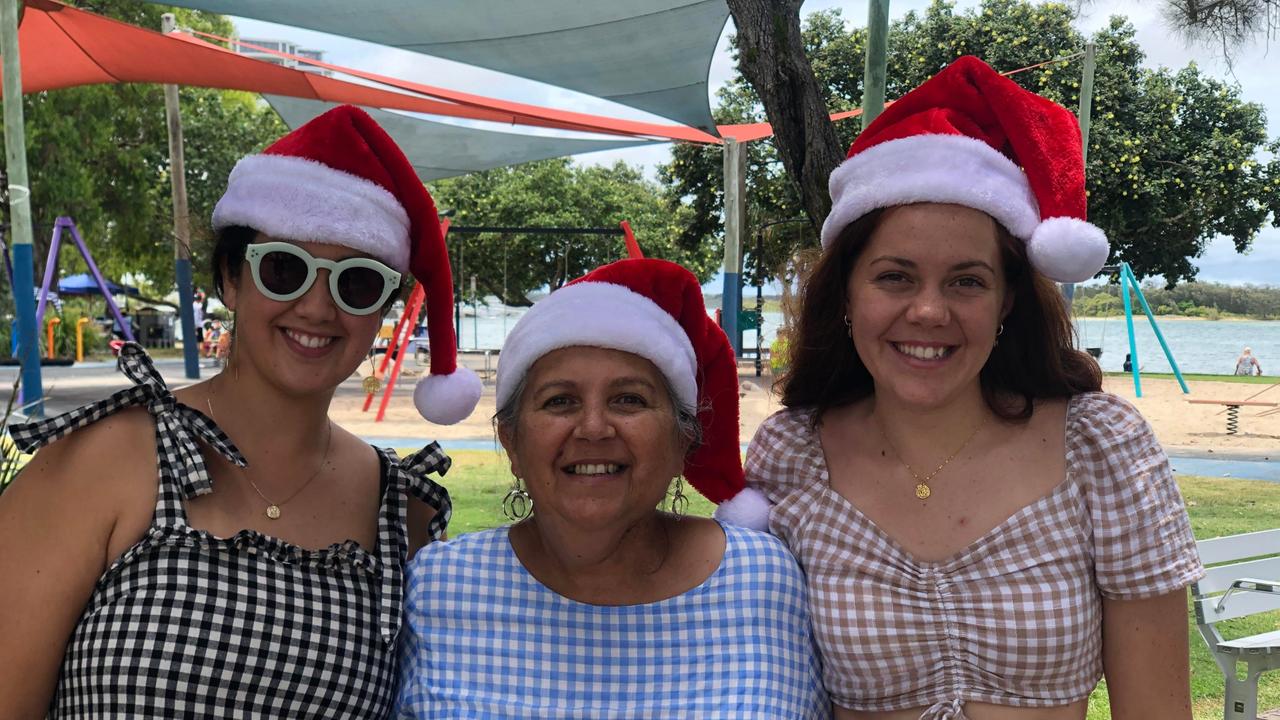 Cassandra Virgen and Sharon and Georgia Lindsay enjoy Christmas celebrations at Cotton Tree Park. Picture: Laura Pettigrew.