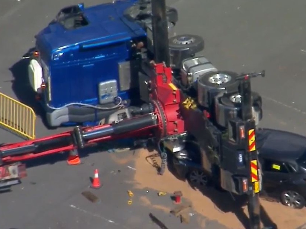 The truck tipped onto a parked car. Picture: 9News Queensland.