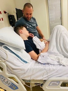 <s1>Eli Kent, 12, with dad Stu at his bedside after his first round of chemotherapy at Queensland Children’s Hospital.</s1> <ld pattern=" "/> <source>Picture: Contributed</source>