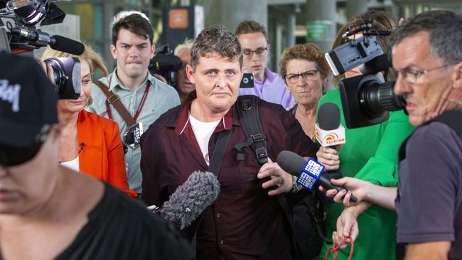 Lawrence is besieged by media at Brisbane International Airport. Picture: Glenn Hunt