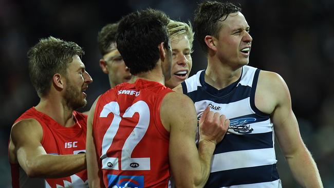 Dean Towers gets into Mitch Duncan after the Cat gave away a free kick in the last quarter. Picture: AAP