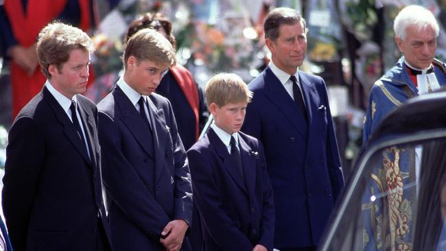 Earl Spencer, Prince William, Prince Harry and Prince Charles stand alongside the hearse containing the coffin of Diana, Princess of Wales, after the funeral service at Westminster Abbey. Picture: BBC News &amp; Current Affairs via Getty Images.