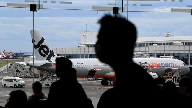 Passengers await flights at Sydney airport as the northern beaches’ COVID-19 cluster puts Christmas plans in doubt. Picture: Joel Carrett