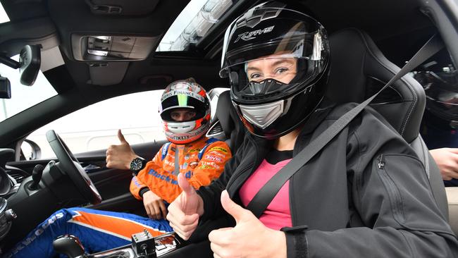 Supercars driver Nick Percat, from Brad Jones Racing, takes The Advertiser journalist Cara Jenkin on a hot lap in a course car at the launch of the OTR SuperSprint at The Bend. Picture: AAP/David Mariuz