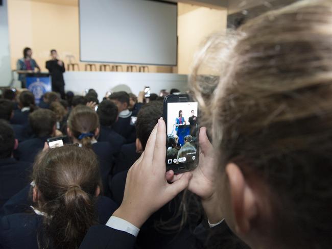 A student gets a shot of Frank Lakoudis. Picture: Melvyn Knipe.Priscilla Sami, and Konstandina Stathopoulos who graduated with Frank in 2008 are big fans. Picture: Melvyn Knipe.