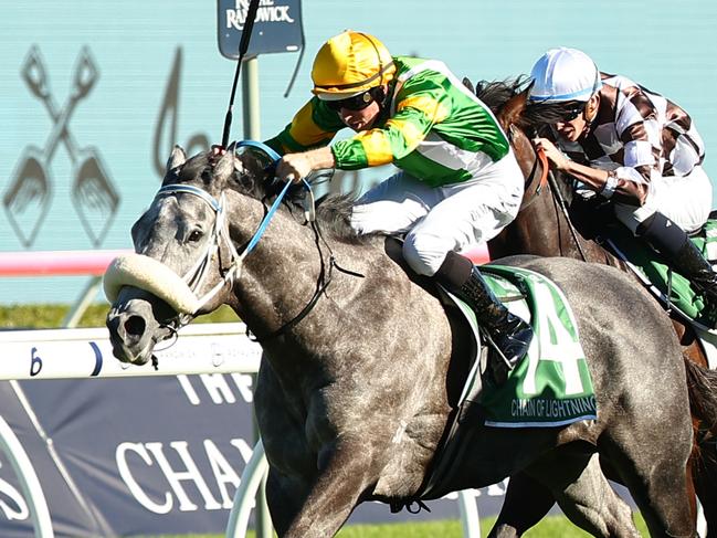 SYDNEY, AUSTRALIA - APRIL 06: Damian Lane riding Chain Of Lightning wins Race 7 James Squire T J Smith Stakes during Sydney Racing at Royal Randwick Racecourse on April 06, 2024 in Sydney, Australia. (Photo by Jeremy Ng/Getty Images)