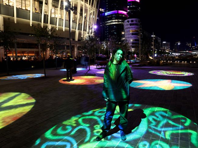 Artist Coda Ridley pictured outside Crown in Barangaroo with projections that feature her artwork for Vivid festival. Picture: Damian Shaw