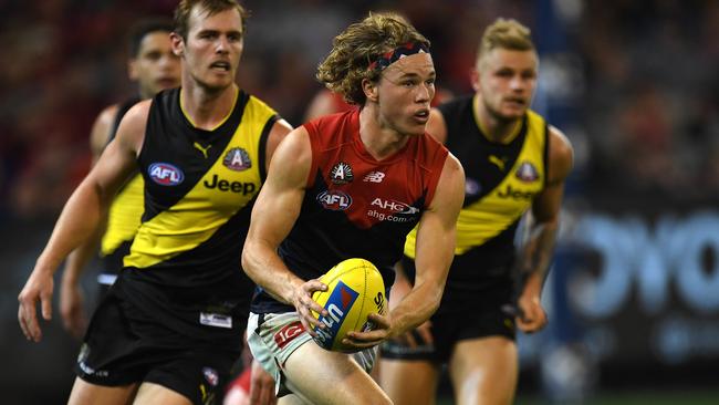 Jayden Hunt streaks through the centre of the MCG.