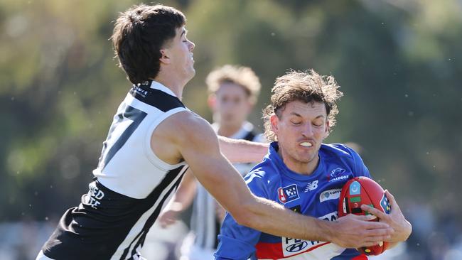 Nicholas Lange from the Bulldogs is tackled by Tom McCallum of the Magpies during the Round 18 SANFL match between Central District and Port Adelaide at Elizabeth Oval in Adelaide, Saturday, August 26, 2023. (SANFL Image/David Mariuz)