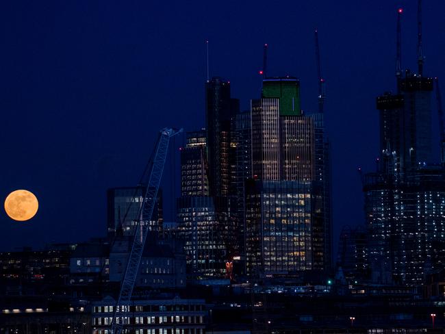 A supermoon rises behind skyscrapers in London, United Kingdom. Picture: Chris J Ratcliffe/Getty Images