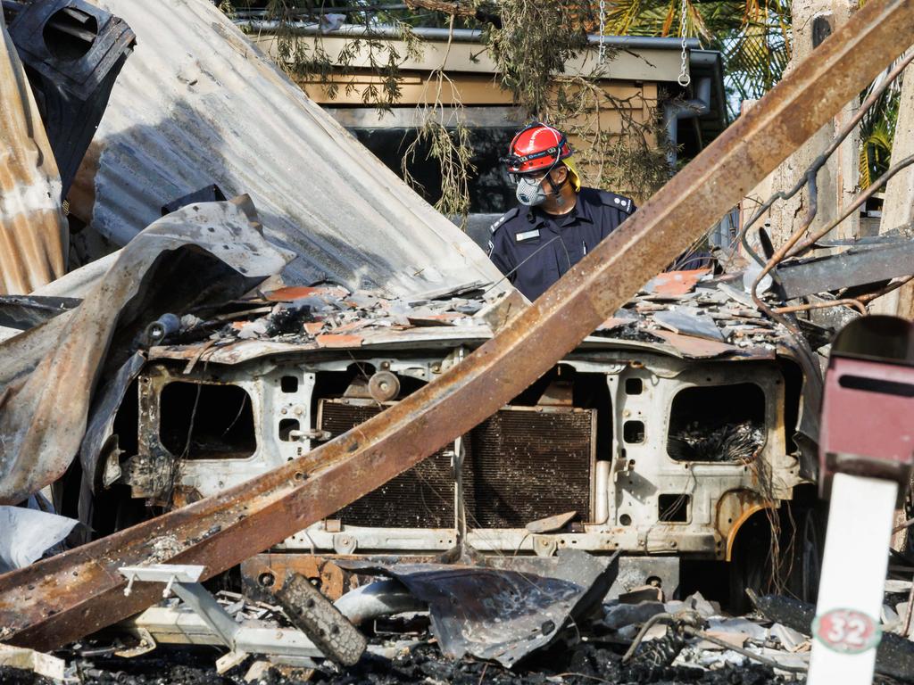 Fire investigators at the scene Sunday morning. It was reported the fire started after someone was refuelling his car and some of it spilled. Picture Lachie Millard