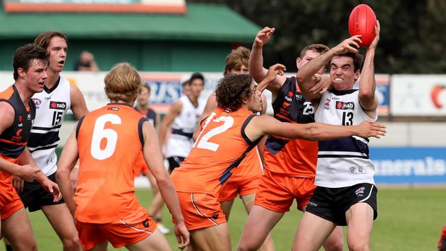 Sam Philp is surrounded by GWS opponents.