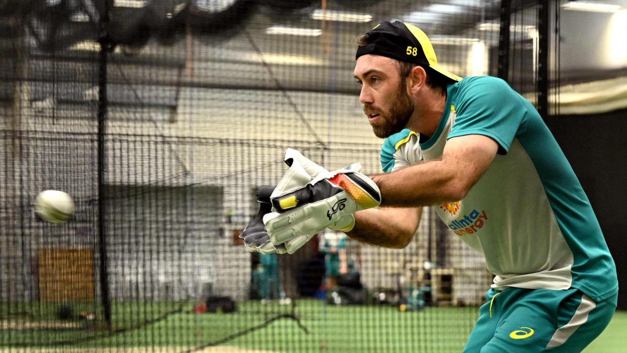 Australian player Glenn Maxwell practices with wicketkeeper gloves in the nets during a training session in Melbourne on October 27, 2022, ahead of their ICC men's Twenty20 World Cup 2022 cricket match against England. (Photo by William WEST / AFP) / --IMAGE RESTRICTED TO EDITORIAL USE - NO COMMERCIAL USE--