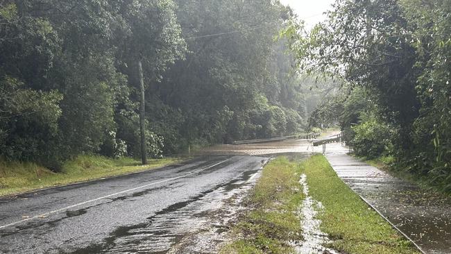 Flood waters overflowing on Stevens Rd at Mooloolah Valley on the Sunshine Coast this morning.