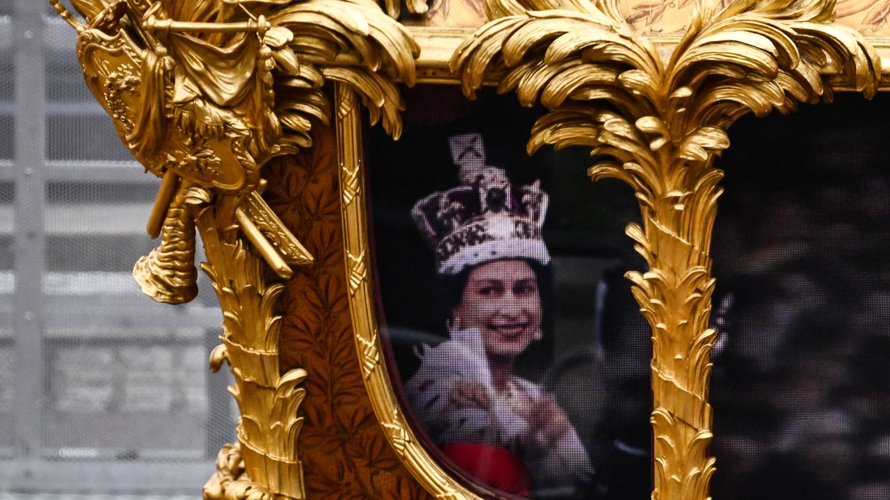 Hologram of Britain's Queen Elizabeth II is projected on the Gold State Coach during the Platinum Pageant. Picture: AFP.