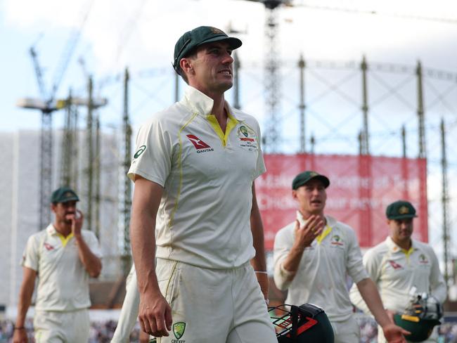 Australia's Pat Cummins leads his player in at the end of play on day three of the fifth Ashes cricket Test match between England and Australia at The Oval cricket ground in London on July 29, 2023. (Photo by Adrian DENNIS / AFP) / RESTRICTED TO EDITORIAL USE. NO ASSOCIATION WITH DIRECT COMPETITOR OF SPONSOR, PARTNER, OR SUPPLIER OF THE ECB