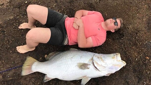 Jesse Bradford next to the enormous fish.