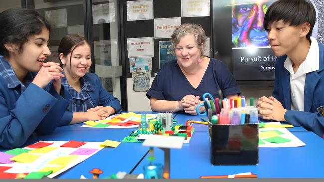 Teacher Claudia Stow runs Project Design at Emmaus College in Vermont South. With Emmaus Yr 10 Project students, L To R – Diore Rozario, Abigail Boog and Nathanael Yeung. Picture David Crosling