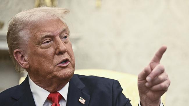 President Donald Trump speaks during a meeting with El Salvador's President Nayib Bukele in the Oval Office of the White House in Washington, Monday, April 14, 2025. (Pool via AP)