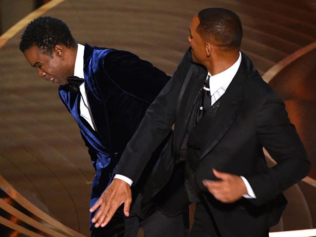 -- AFP PICTURES OF THE YEAR 2022 --  US actor Will Smith (R) slaps US actor Chris Rock onstage during the 94th Oscars at the Dolby Theatre in Hollywood, California on March 27, 2022. (Photo by Robyn Beck / AFP) / AFP PICTURES OF THE YEAR 2022