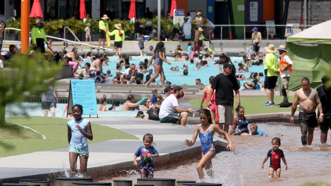 Orion Lagoon, Springfield, in full swing on a hot January day. Photo: AAP/Steve Pohlner