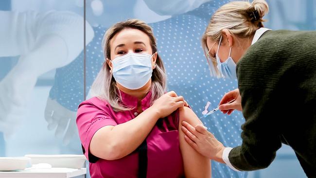 Nursing home employee Sanna Elkadiri receives the first Pfizer vaccine in the Dutch town of Veghel. Picture: AFP