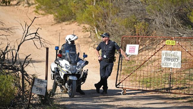 Police at the entrance to the Ponde property. Picture: Tom Huntley