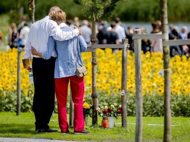 Relatives embrace during the opening of the national monument for the MH17 victims in Vijfhuizen. Picture: Remko de Waal/ Pool via AP