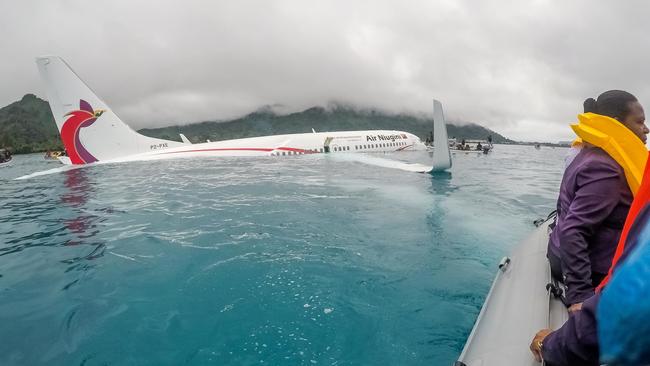 US Navy sailors help locals shuttle the passengers and crew of Air Niugini flight PX56 after the crash. Picture: Lt. Zach Niezgodski/US Navy