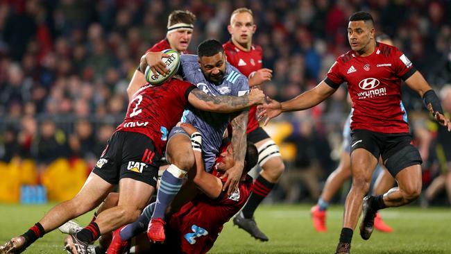 Hurricanes centre Ngani Laumape crashes into the brutal Crusaders defence