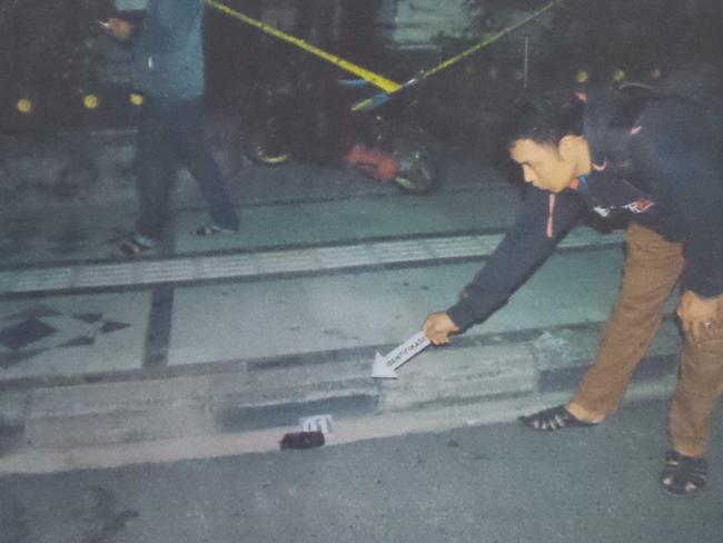 A mobile phone and a motor bike at the crime scene. Picture: Supplied