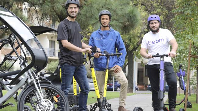 Tom Cooper of RIDE, Daniels Langeberg from EcoCaddy and Paul Frazer from Beam at Hurtle Square to launch new e-scooters in Adelaide CBD. Picture: Dean Martin