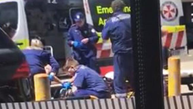 Paramedics and police at shooting scene. Picture: Supplied