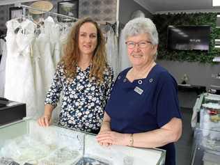 Owner of Rendezvous Designs and founder of Burnett Bridal and Formal Events Helen Chaseling and wedding celebrant Rhonda Callow inside the shared showroom. Picture: Laura Blackmore