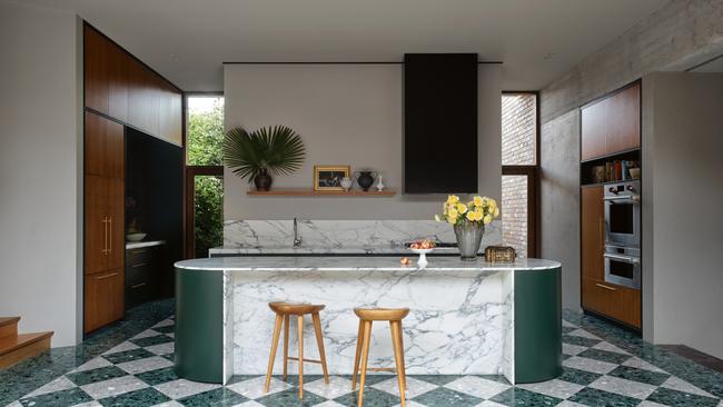 By adding decorative pieces on a floating shelf, mixed with handmade ceramics and a Murano glass vase to a kitchen, the space is transformed into something unexpected.