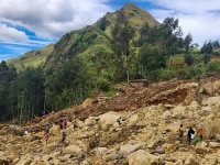 Villagers search amongst the debris from a landslide in the village of Yambali in the Highlands of Papua New Guinea. Picture: Mohamud Omer/International Organization for Migration via AP
