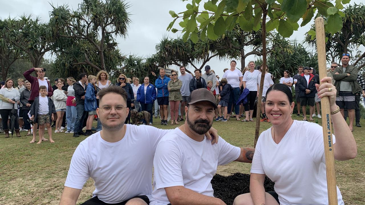 Balin’s brother Jacob Stewart, left, with parents Michael and Kerri-Lyn Stewart, at Saturday's tree planting for Balin at Point Cartwright Reserve.