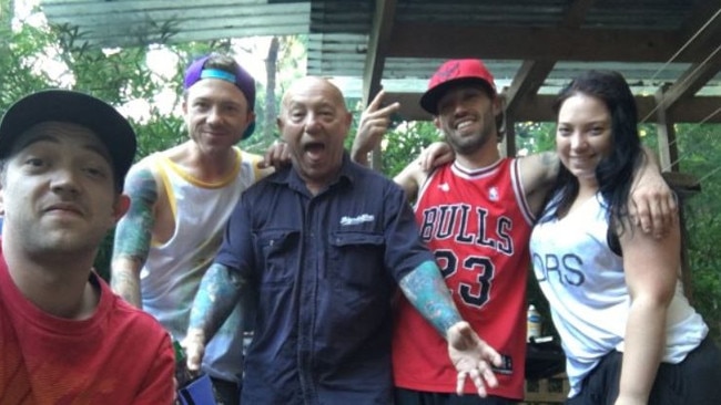 Rock icon Angry Anderson, centre, with his children including Liam (left, front) said they were ‘bound in grief’ by Liam’s killing.