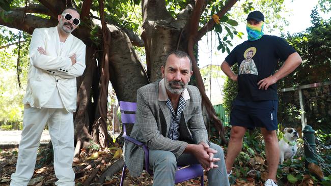 Electronic musicians Jonny Seymour, eft, and Paul Mac with street artist Scott Marsh, right, who painted the St George mural. Picture: John Feder