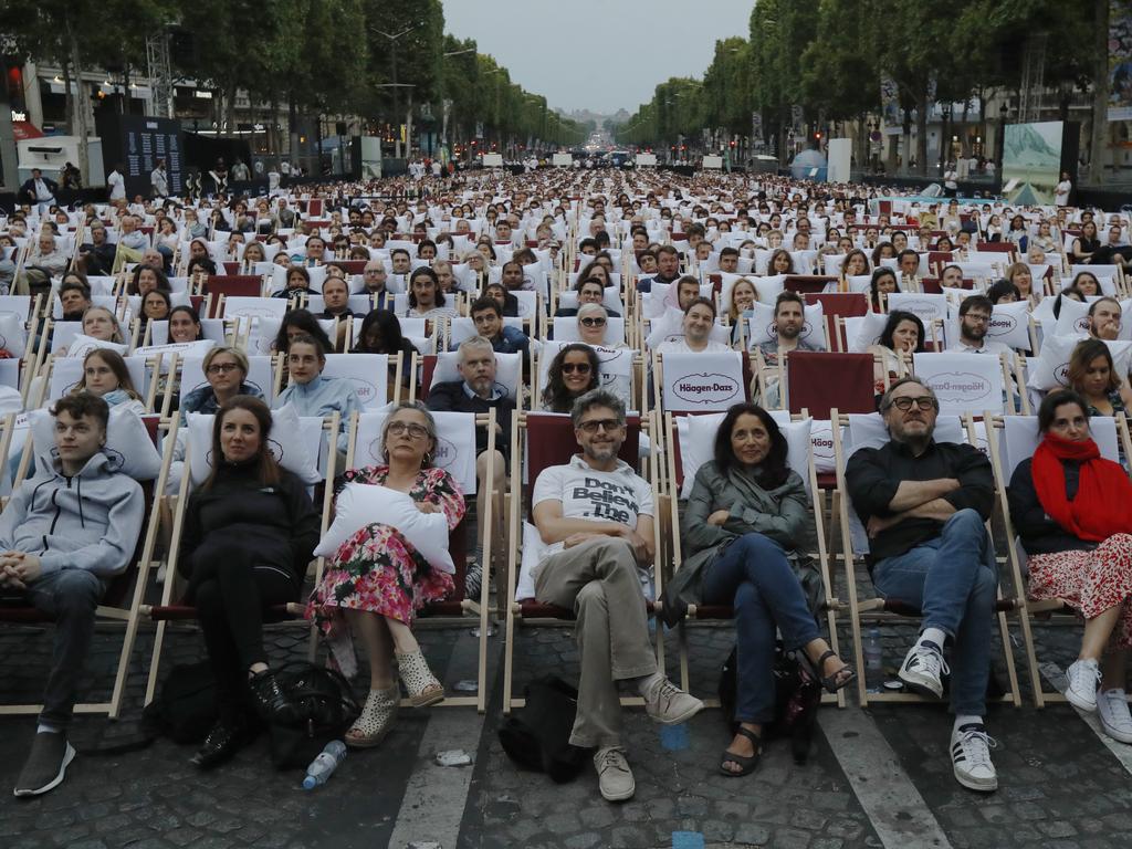 Movie-goers watch a free outdoor film at the Champs Elysees in Paris. Picture: AP