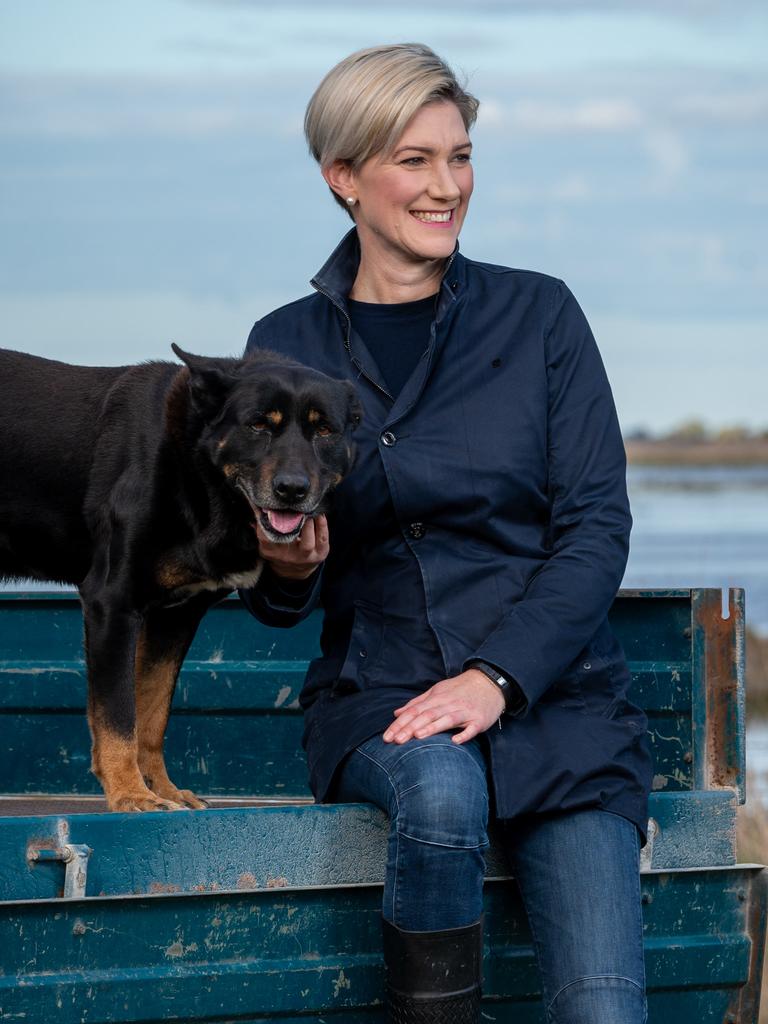 Nicolle Flint, with dog Mister, is happy to be back in the game. Picture: Naomi Jellicoe